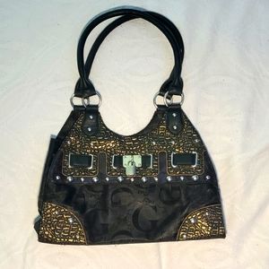 Black and brown purse with leather.